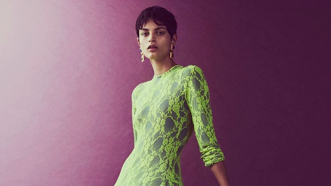 Model wears green dress and Ben-Amun Isadora earrings for Elle Canada
