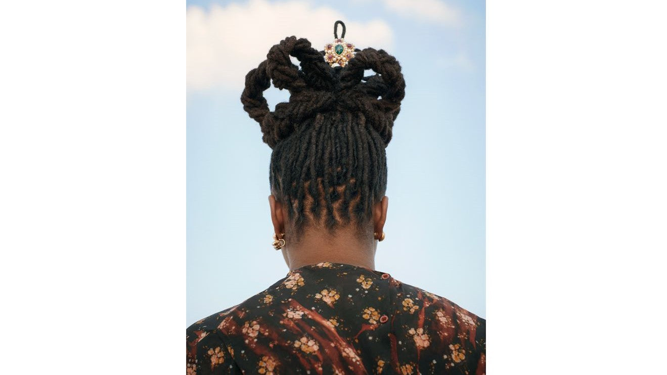 Model wearing Ben-Amun brooch in her hair for Allure