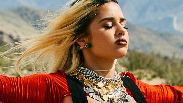 Tommy Genesis in Ben-Amun against mountain backdrop