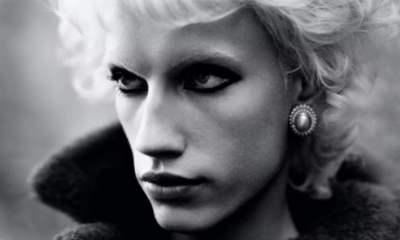 Model wears pearl encrusted earrings from Ben-Amun in a black and white close-up image