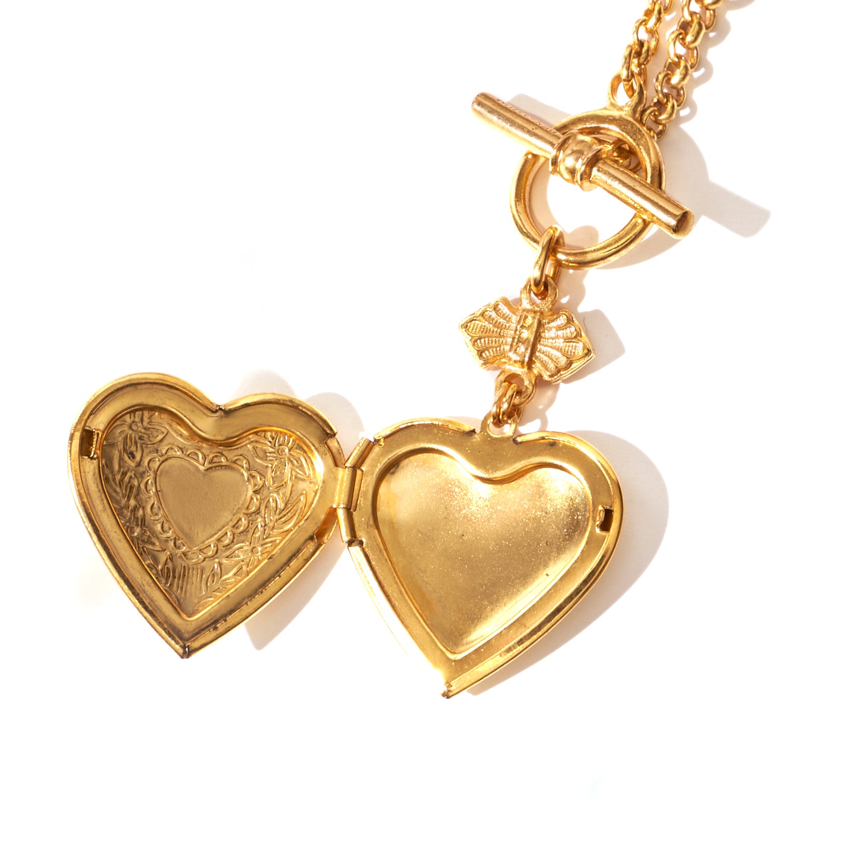 close up of open heart locket necklace with toggle closure 