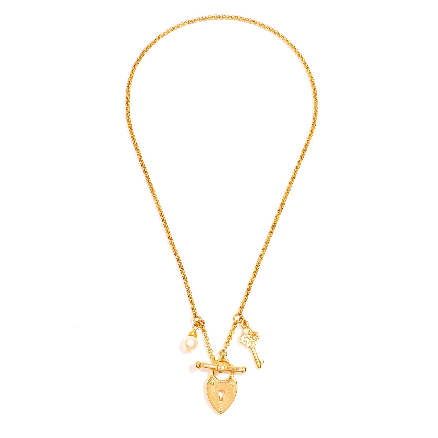 gold statement locket necklace with pearl and key charms 