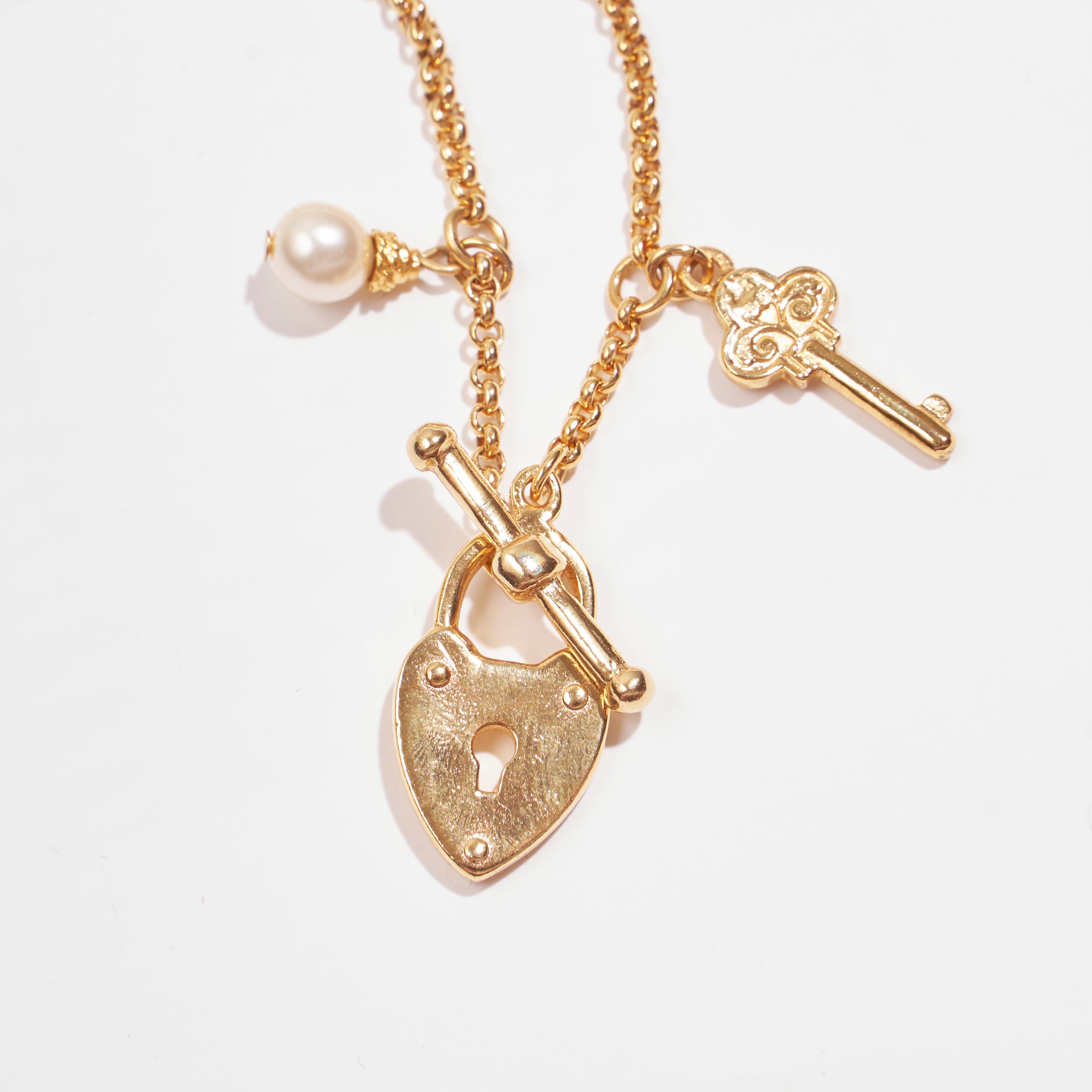 close up of gold locket and toggle closure