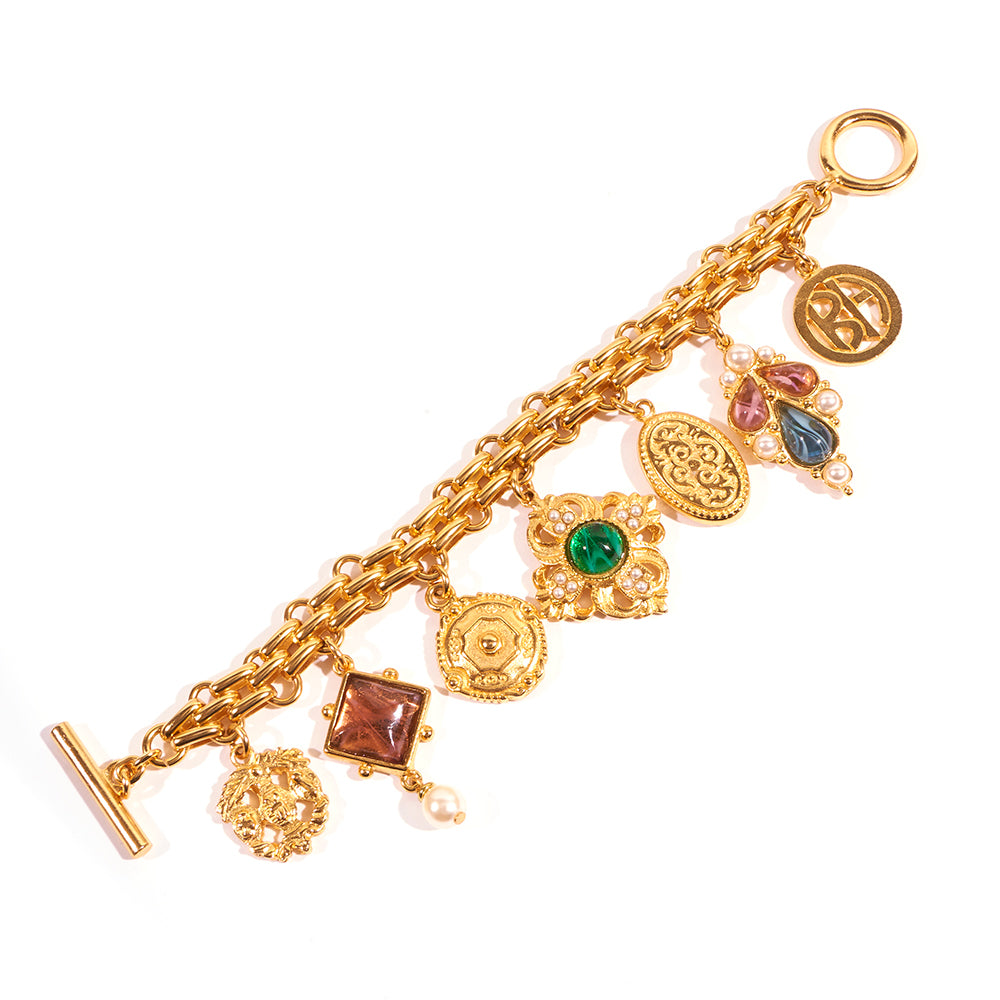 24k gold plated bracelet with toggle closure featuring purple, blue and green czech glass stone 