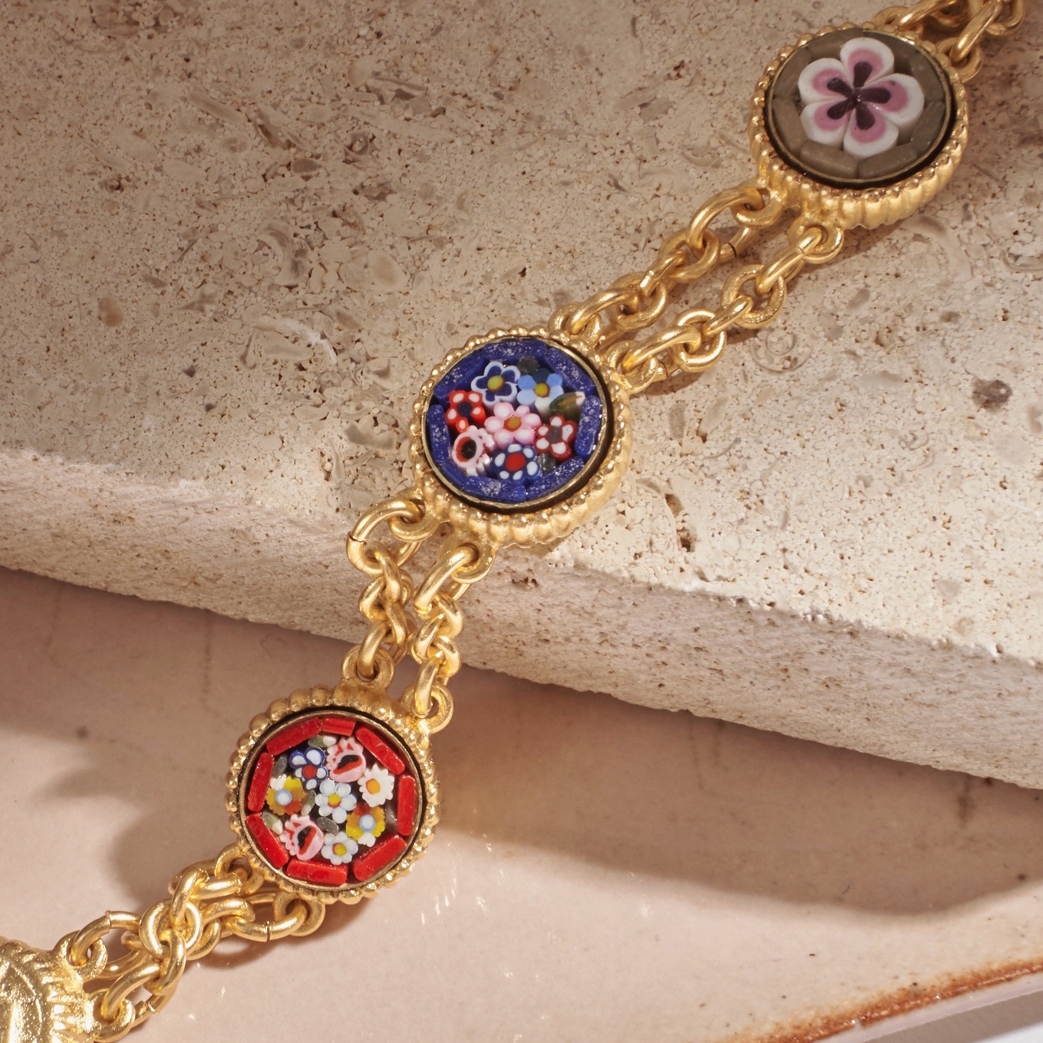 flatlay of Ben-Amun mosaic bracelet against stone background 