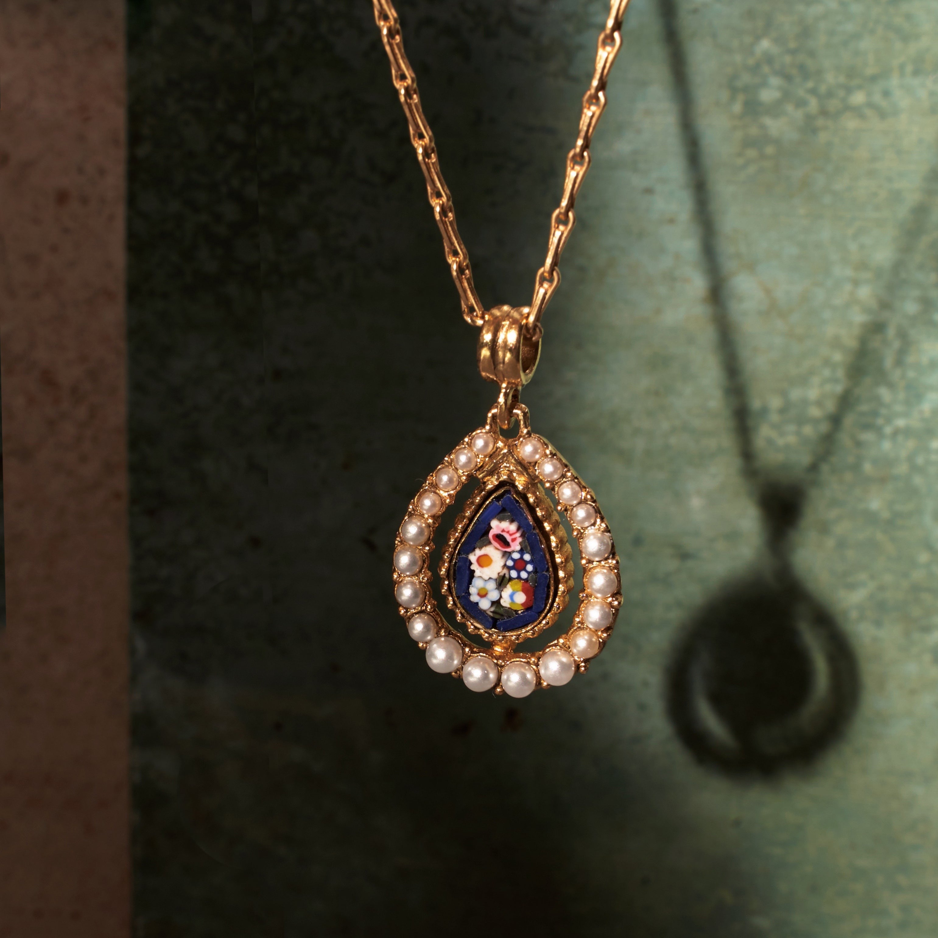 Ben-Amun Anastasia Necklace against green and stone background