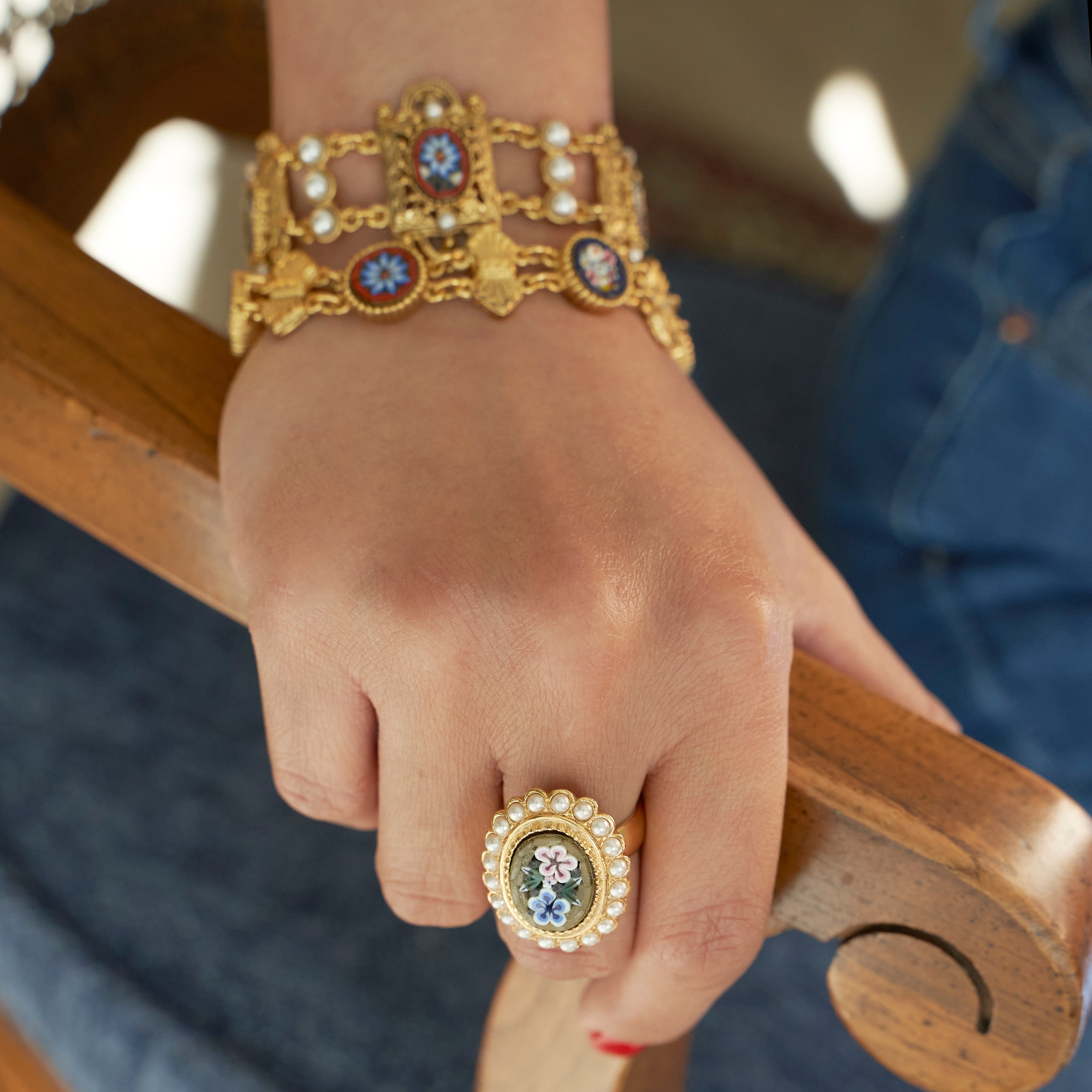model wearing two daphne collection bracelets paired with a daphne collection ring