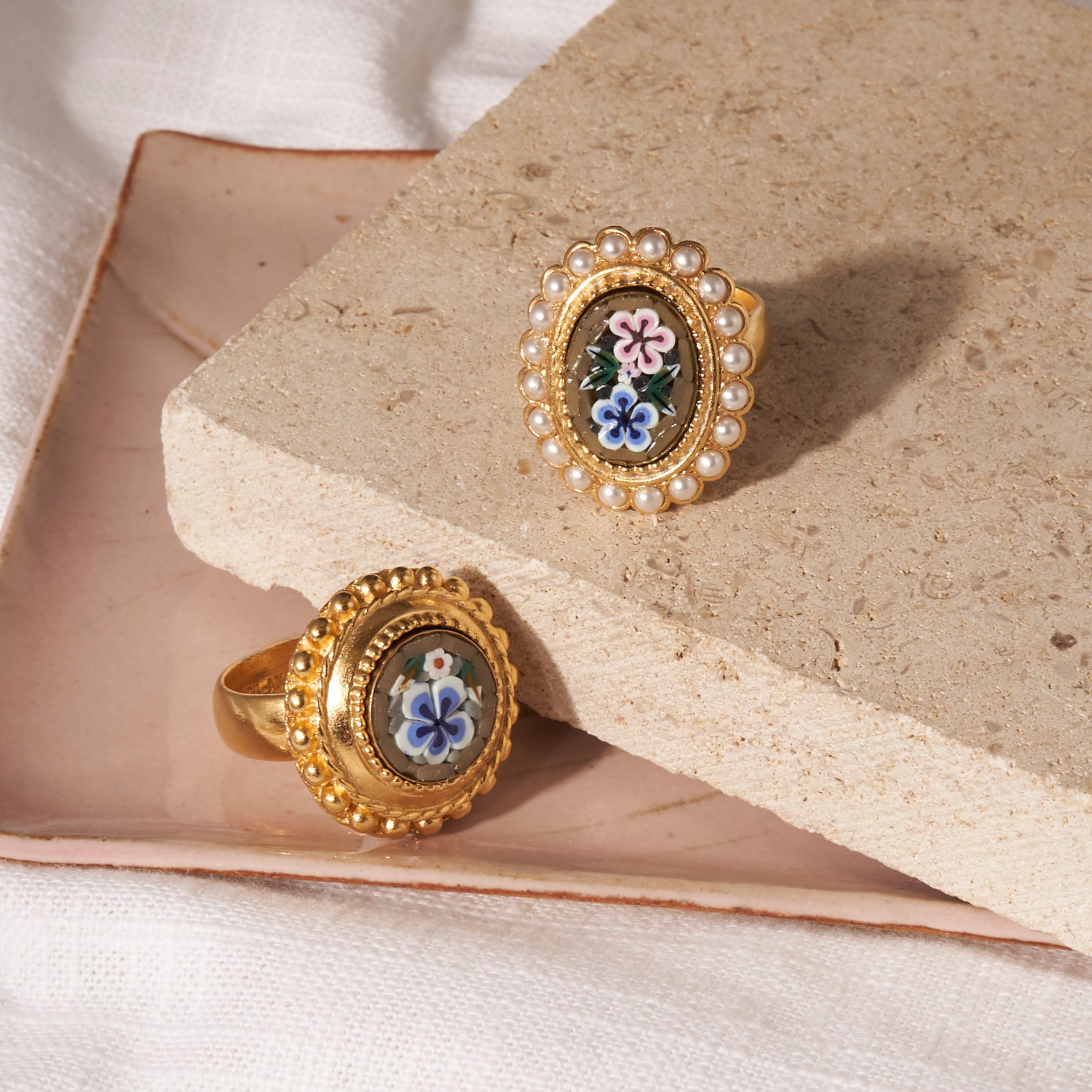 flatlay of two ben-amun daphne collection rings