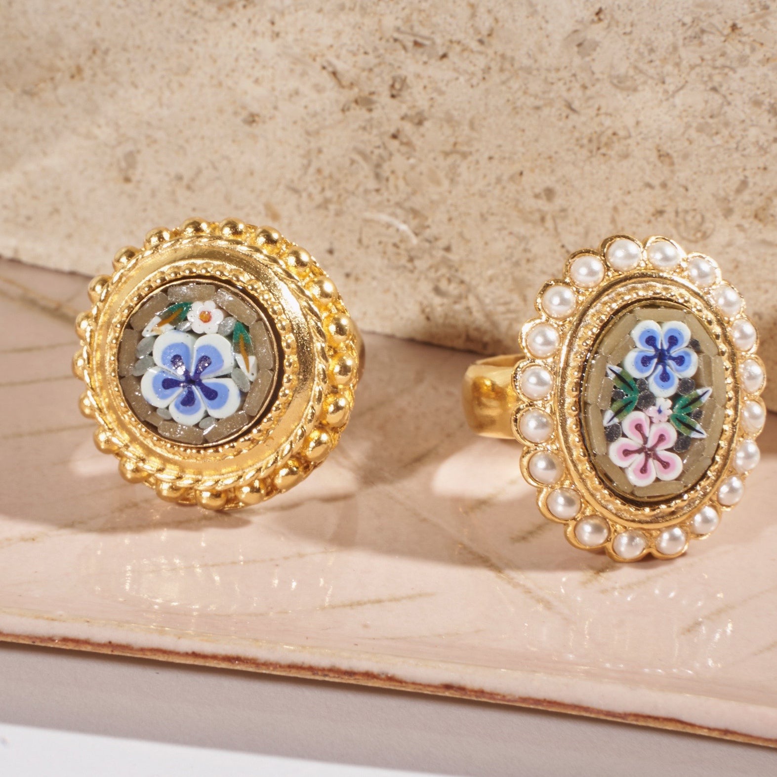 flatlay of two ben-amun gold plated mosaic rings