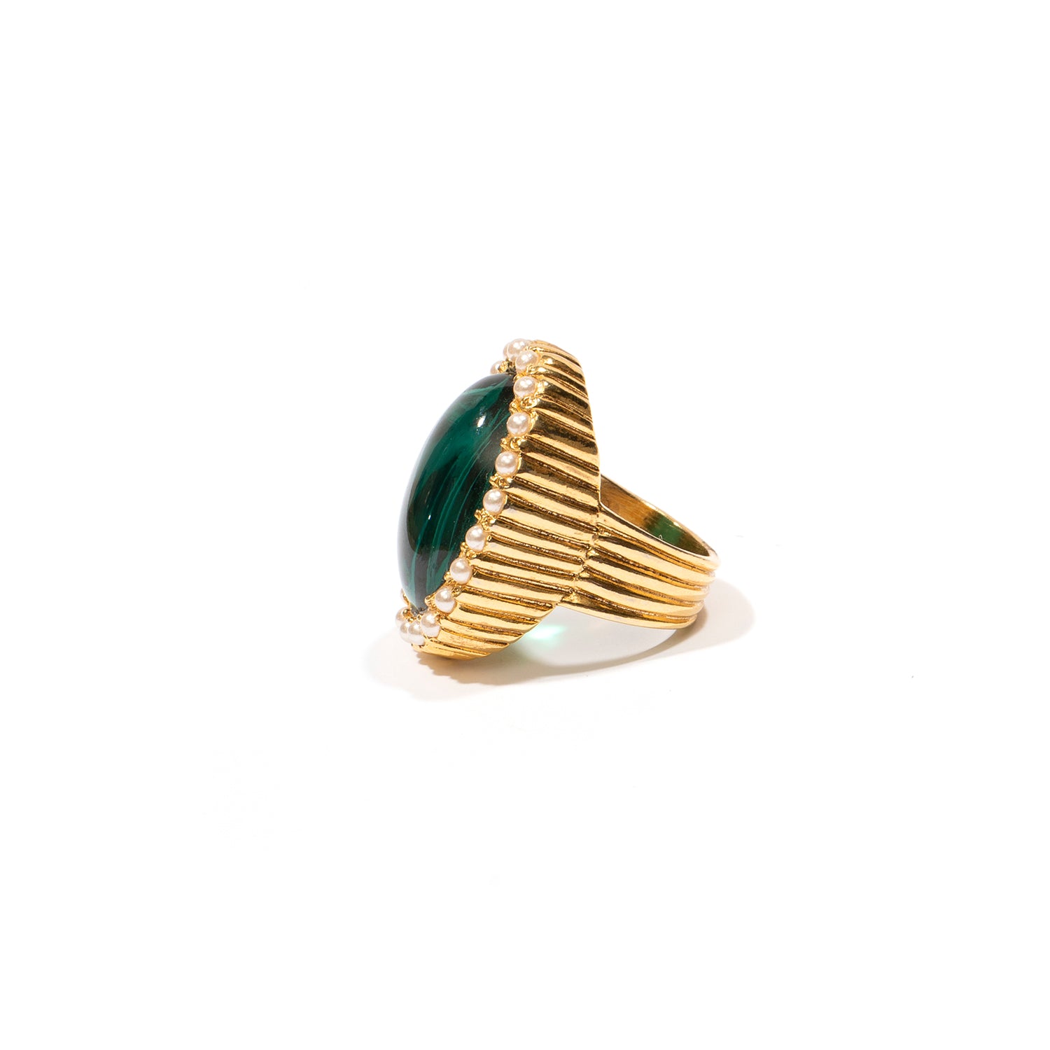 Side view of Ben-Amun gold ring with emerald czech glass stone