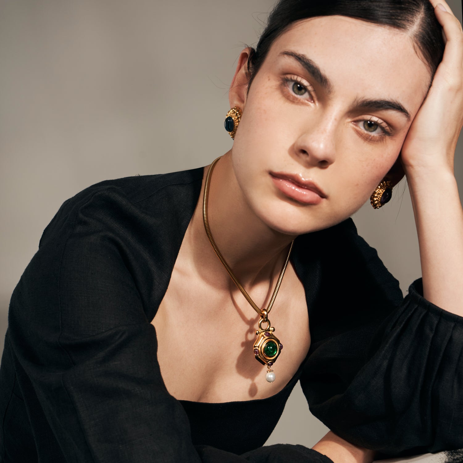 model. wearing ben amun gold necklace and earrings featuring czech glass stones and majorca pearls 
