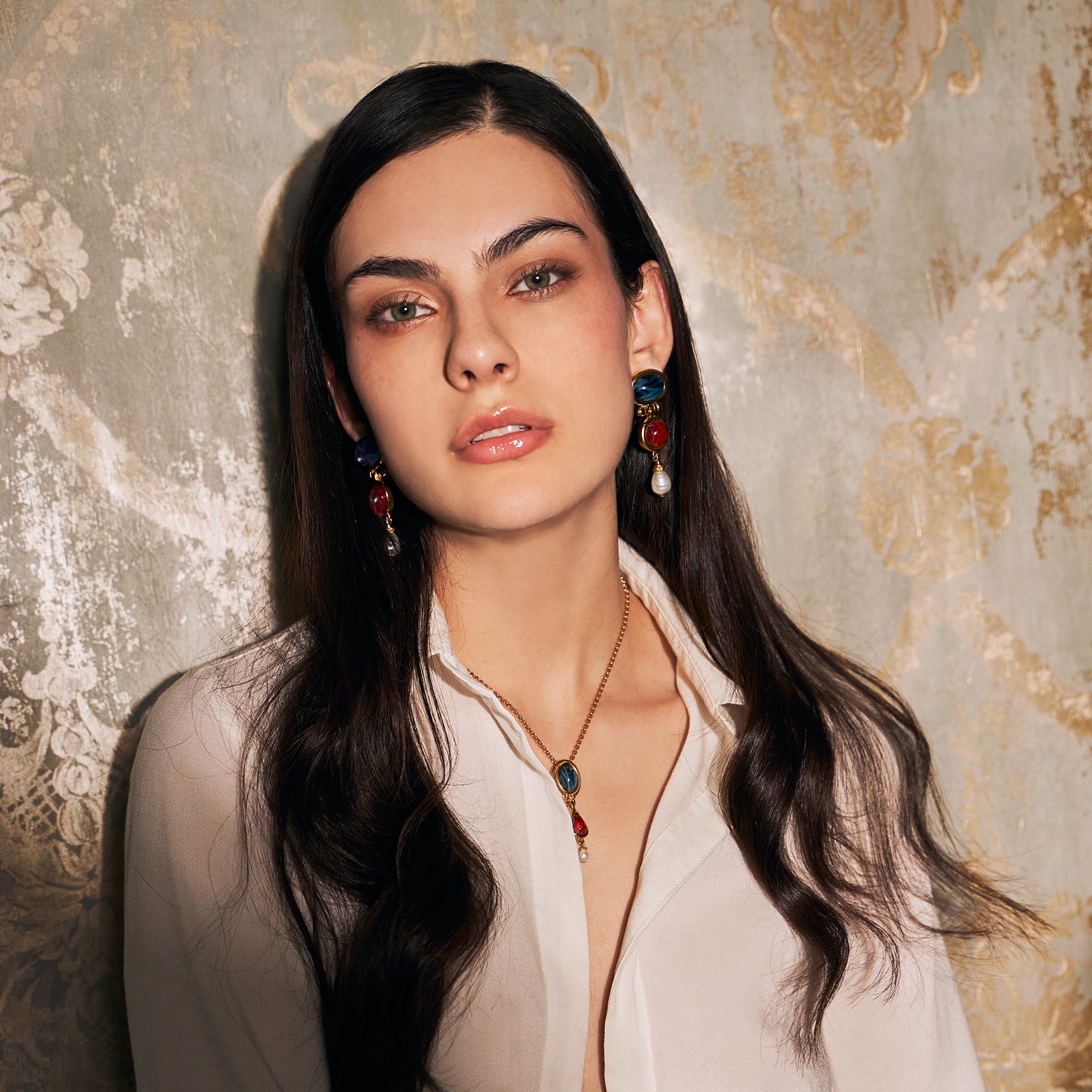 model wearing ben amun's lucresia collection which features necklaces, bracelets, and earrings, adored with majorca glass pearls and czech glass stones 