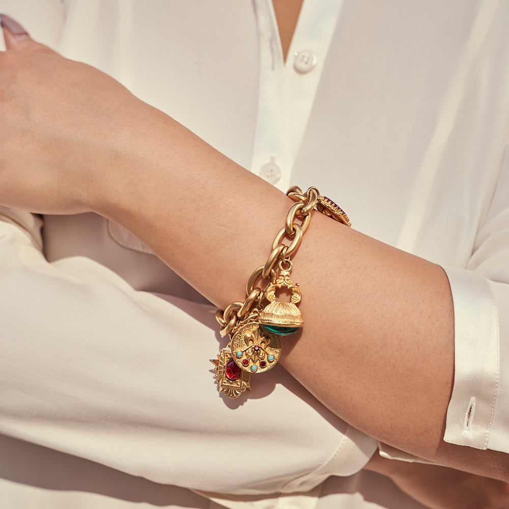 model wearing gold chain link bracelet with majorca pearls, czech glass stones, and resin stones