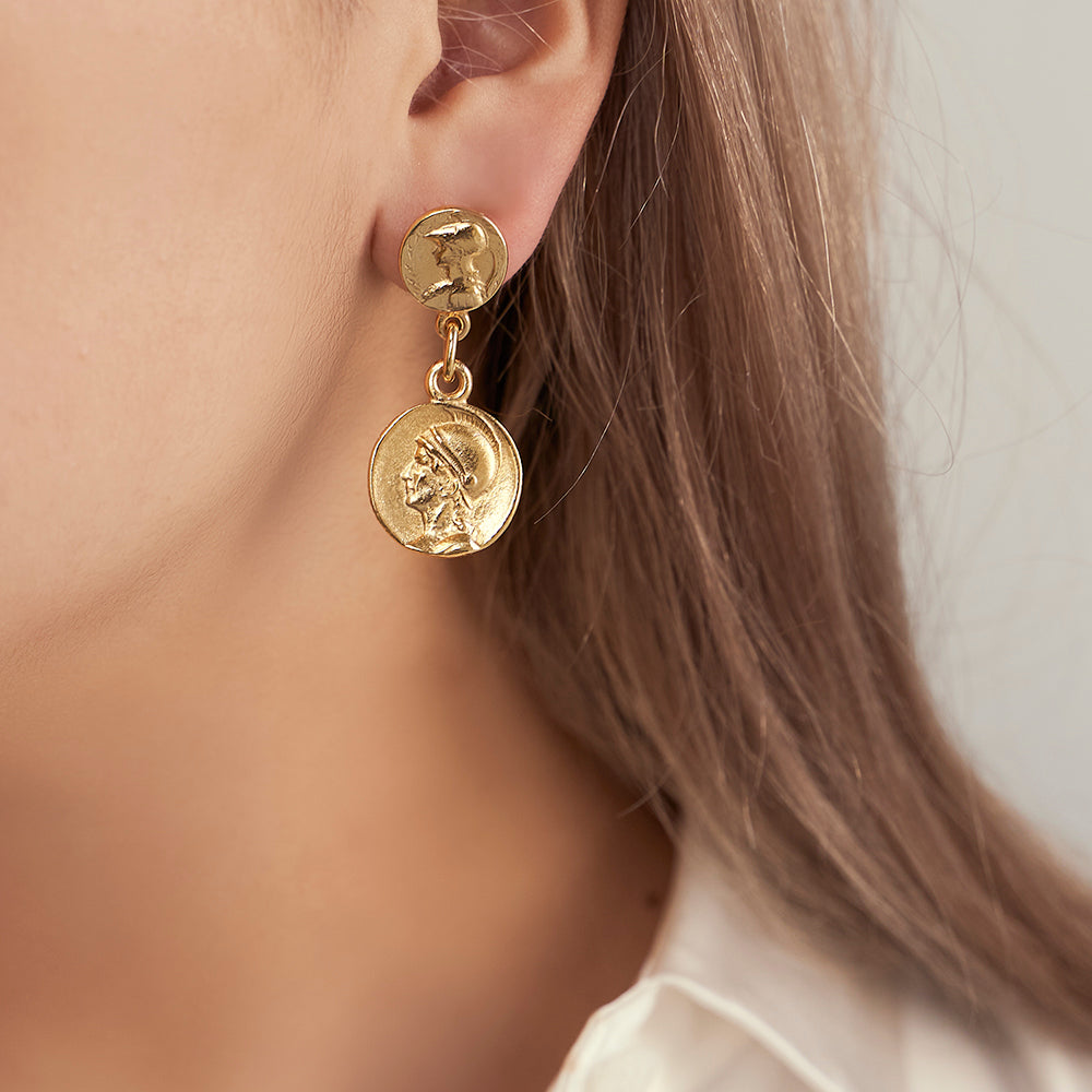 model wearing roman gold coin stud earrings 