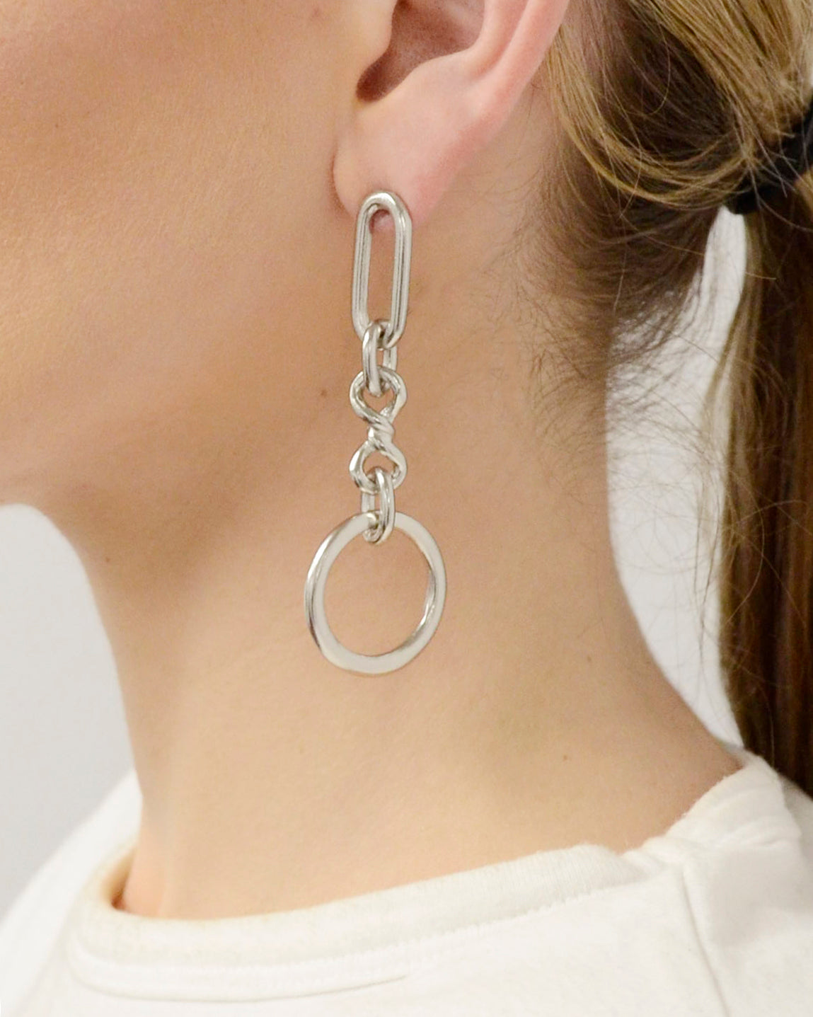model wearing ben-amun silver hoop drop earrings