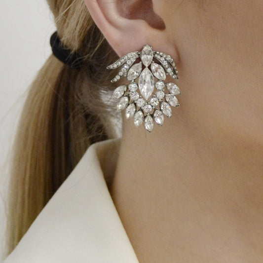 Model wearing clear cut crystal earrings