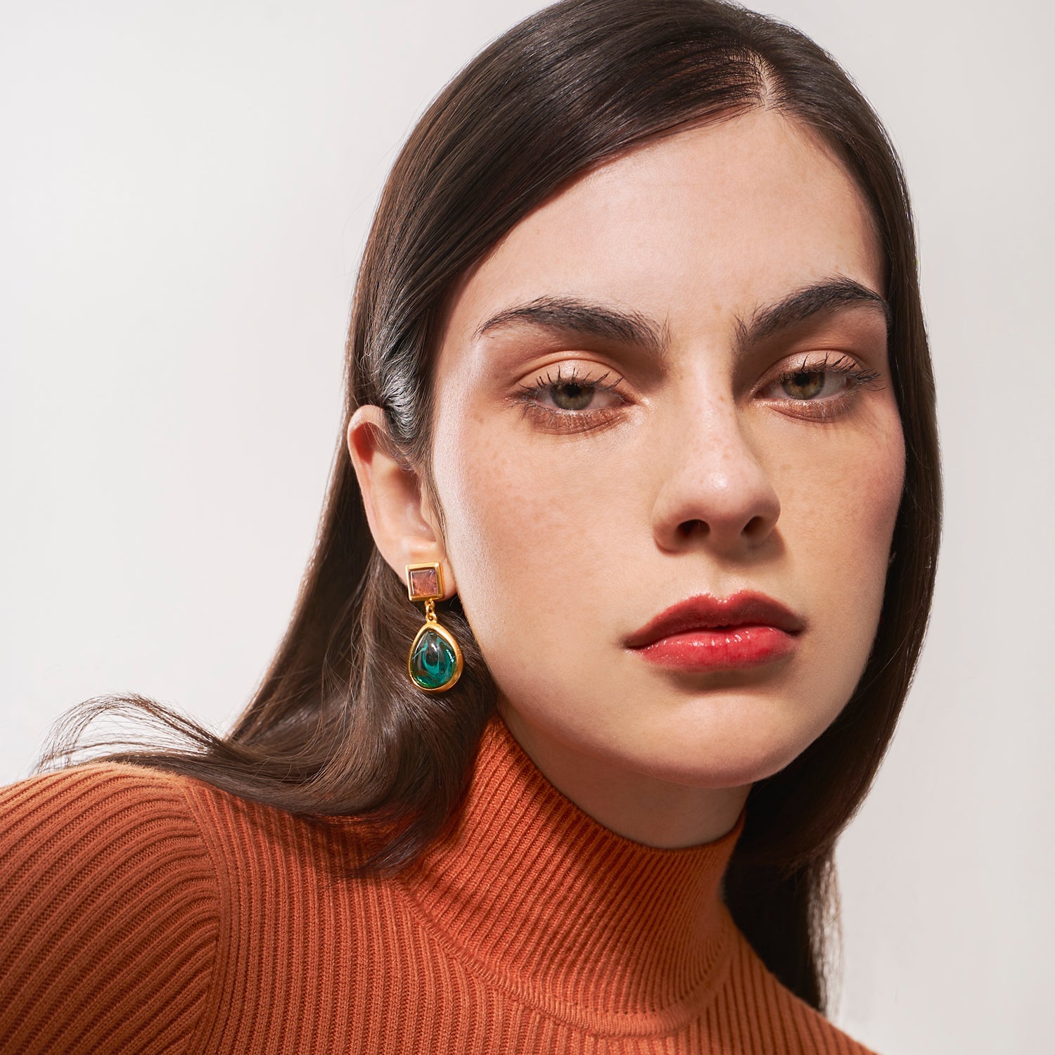 model wearing gold ben amun post earrings